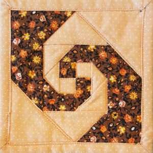 Snail's Trail Miniature Block size 4in pieced with pale orange and brown fabrics