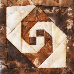 Snail's Trail Miniature Block size 3in pieced with white and brown batik fabrics