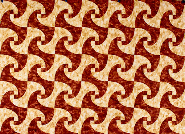 Twisted Log Cabin quilt image with no sashing between blocks